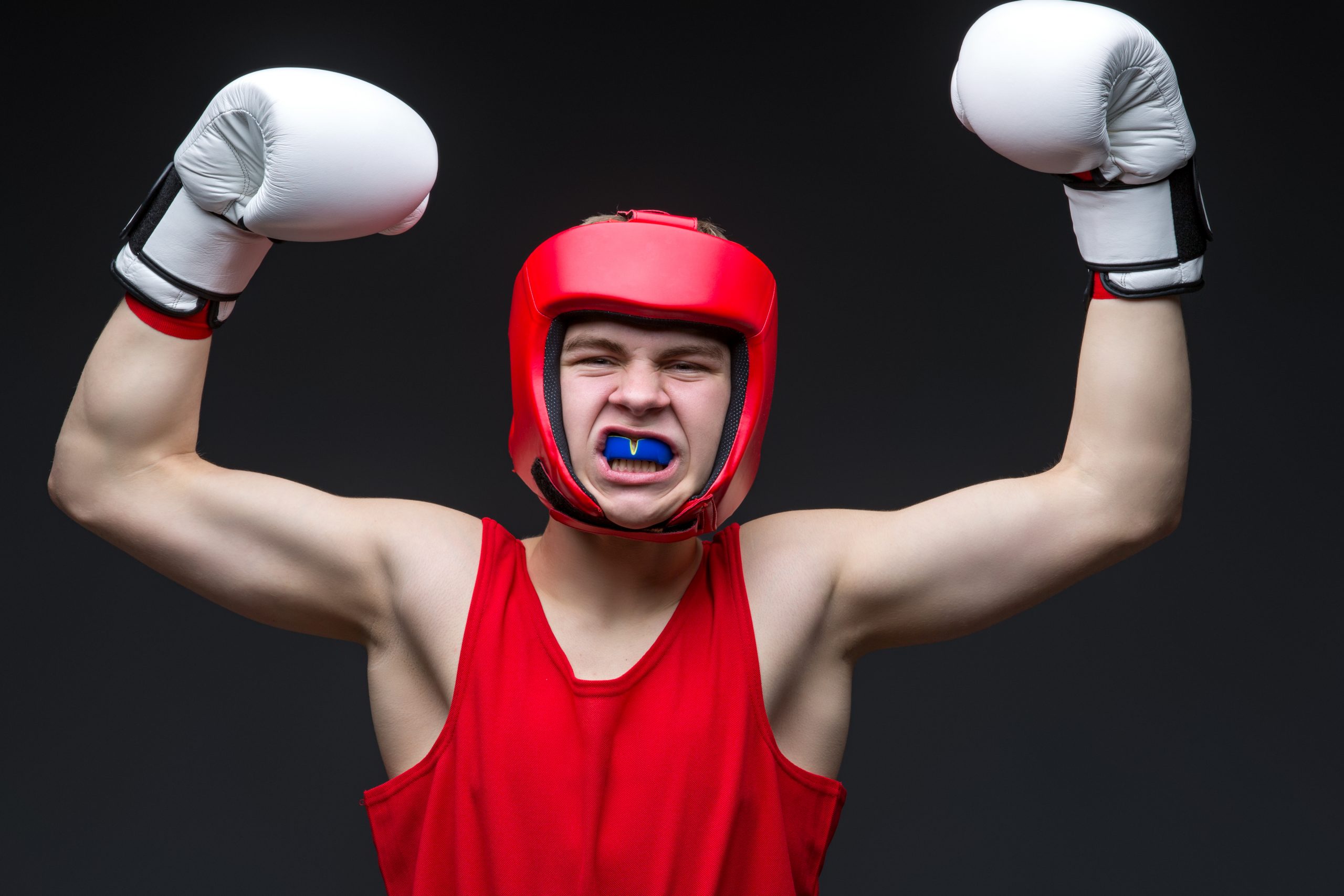 writing/boxing champion in red form and white boxing gloves